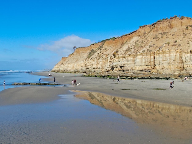 Aerial view of Del Mar North Beach, California coastal cliffs and House with blue Pacific ocean