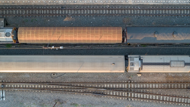 Aerial view of diesel locomotive Train and railway tracks - top view pov of Industrial conceptual scene with trains