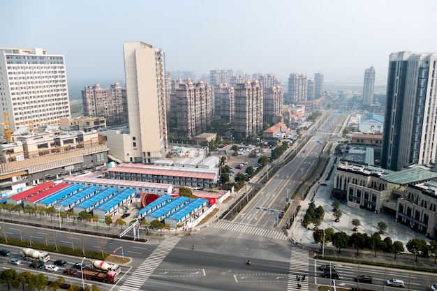 Aerial view of the district in Shanghai with roads and high-rise buildings