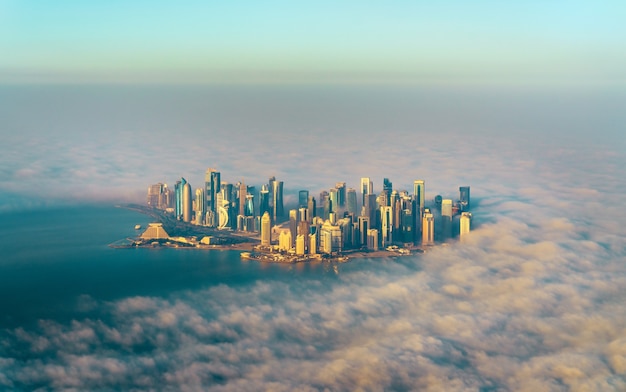 Aerial view of Doha through the morning fog, the capital of Qatar in the Persian Gulf