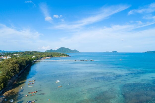 Aerial view drone shot of tropical sea at rawai beach Phuket Thailand Beautiful scenery andaman sea and small island in summer season Beautiful travel background and website design nature view.