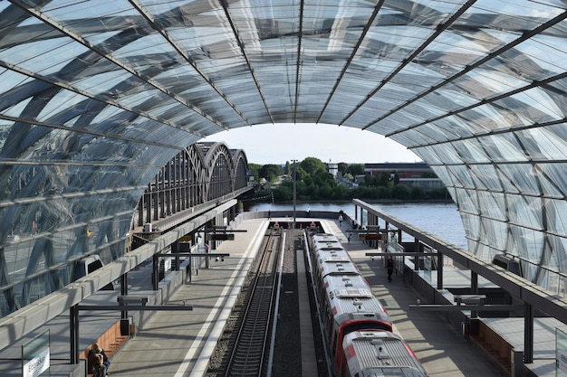 Aerial view of the end of a railway under a glass arch