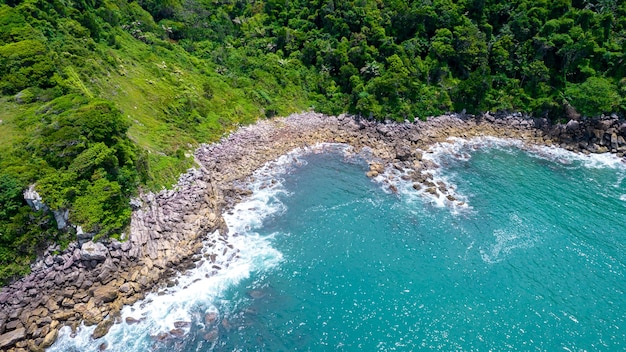 Aerial view of Enseada beach in Guaruj, Brazil. rocks and blue sea on the coast.