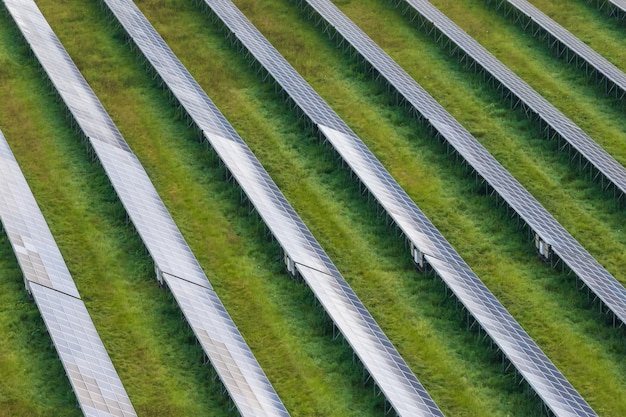 Aerial view on farm field of solar panels Renewable solar energy