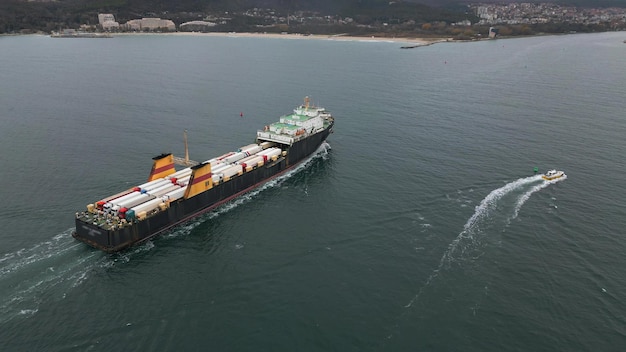 Aerial view of a ferry boat transporting trucks in the sea