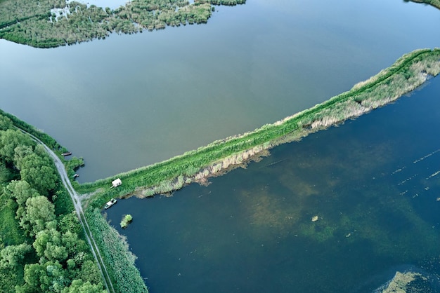 Aerial view of fish hetching pond with blue water in aquacultural area