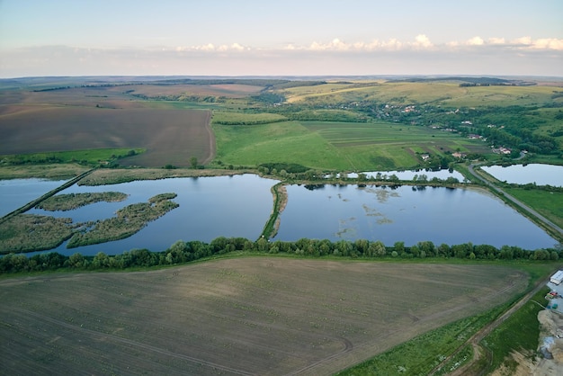 Aerial view of fish hetching pond with blue water in aquacultural area