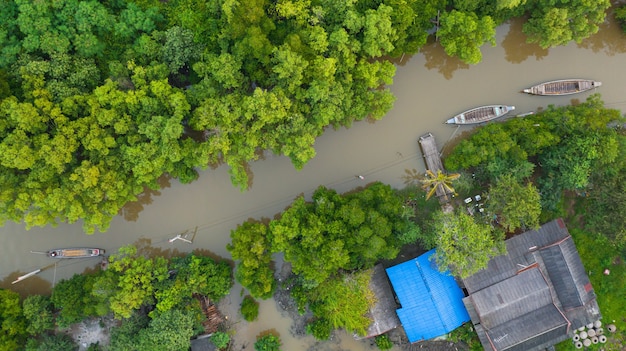 Aerial view fisherman boat in the countryside thailand, Cinematic shot from above of idyllic local life in thailand