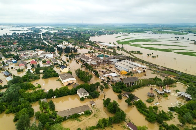 Aerial view of flooded houses with dirty water