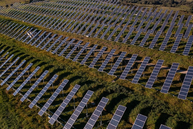 Aerial view flying over a solar panel farm