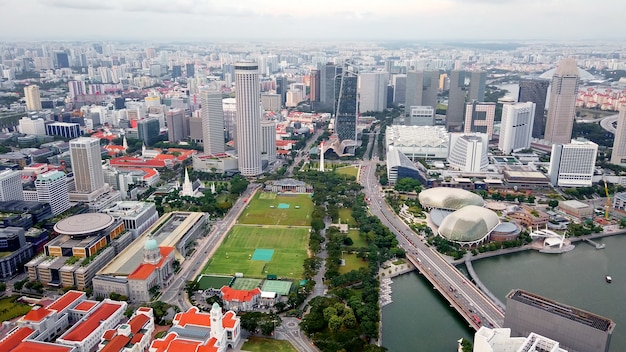 Aerial view from drone of business center, downtown, public park, skyscraper city Singapore.