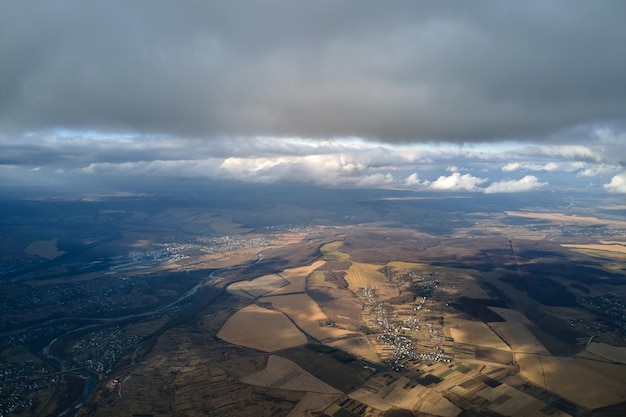 Aerial view from high altitude of earth covered with puffy rainy clouds forming before rainstorm