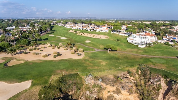 Aerial. View from the sky at the golf courses in the tourist town Vale de Lobo. Vilamoura.