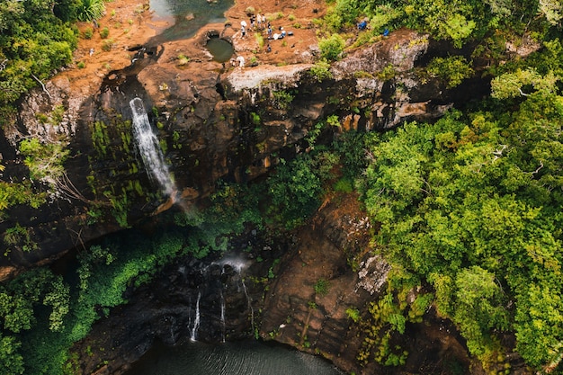 Aerial view from above of the Tamarin waterfall seven cascades in the tropical jungles