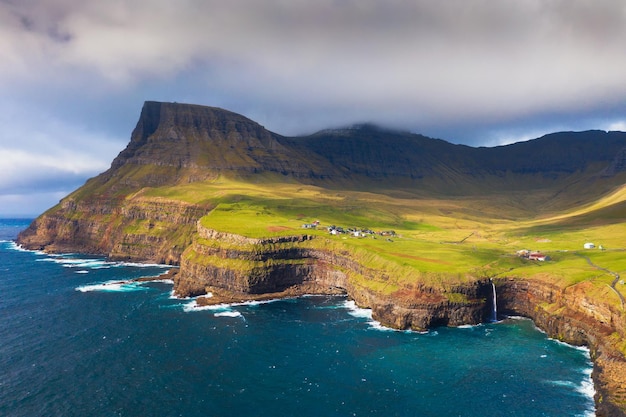 Aerial view of gasadalur village and its waterfall in faroe islands denmark