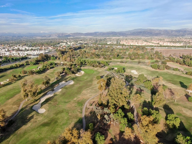 Aerial view over golf field Large and green turf golf course in South California USA