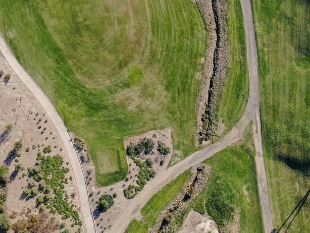 Aerial view over golf field. Large and green turf golf course in South California. USA