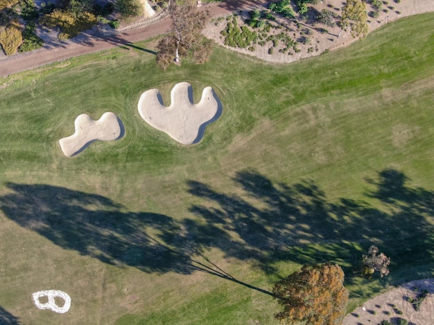 Aerial view over golf field. Large and green turf golf course in South California. USA