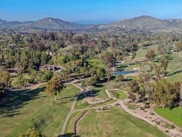 Aerial view over golf field. Large and green turf golf course in South California. USA