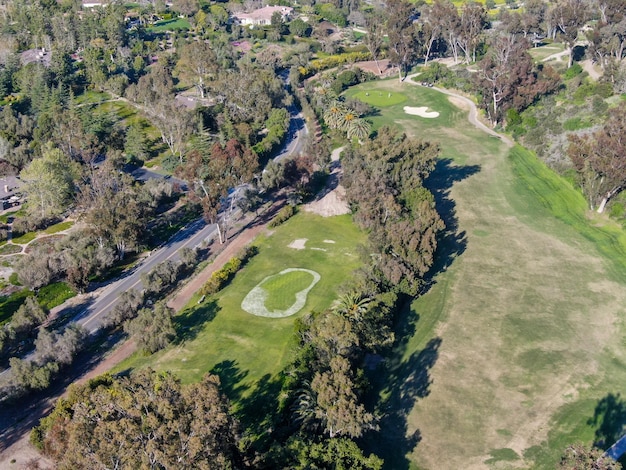 Aerial view over golf field. Large and green turf golf course in South California. USA