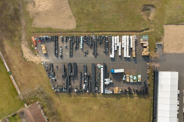 Aerial view of goods storage on warehouse yard and logistics center in industrial zone from above