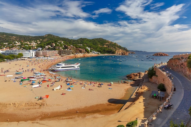 Aerial view of gran platja beach and badia de tossa bay in tossa de mar on the costa brava catalunya...