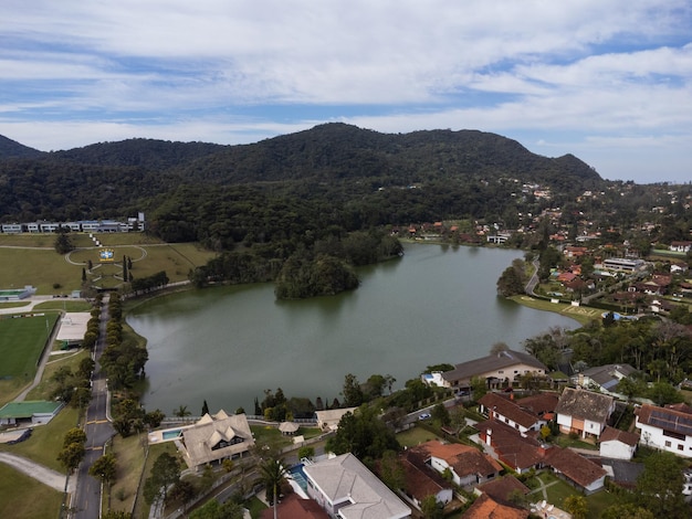 Aerial view of Granja Comary Carlos Guinle neighborhood in the city of Teresopolis Mountain region of Rio de Janeiro Brazil Drone photo Houses lake and hills and mountains