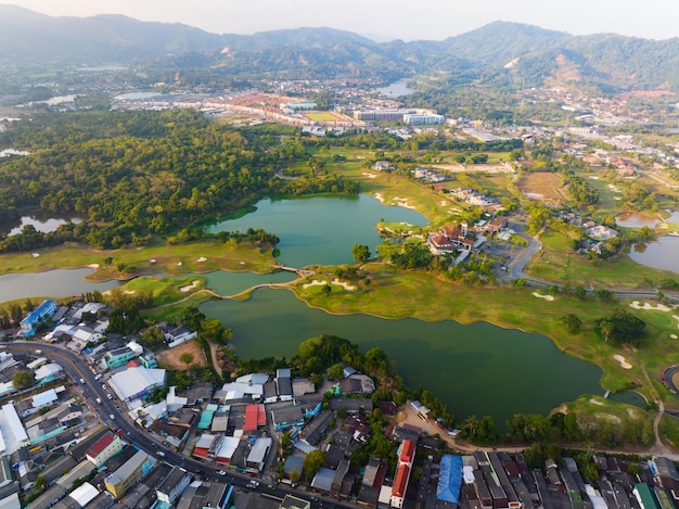 Aerial view of green golf course in Kathu district Phuket Thailand Drone camera High angle view landscape