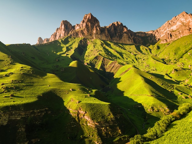 Aerial view of the green mountains and hills at sunset Aktoprak Pass in North Caucasus Russia