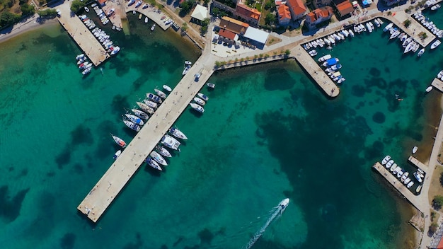 Aerial view of harbor boats and yachts docked in port high quality photo