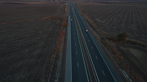 Aerial view of highway road at sunset in autumn Top view from drone of road