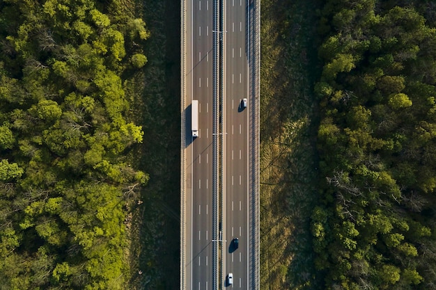 Aerial view of highway road with moving cars