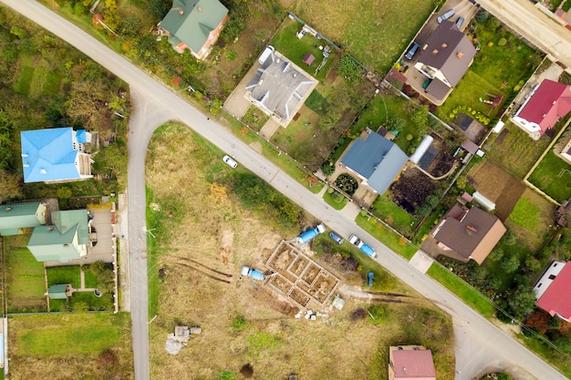 Aerial view of home roofs in residential rural neighborhood area.