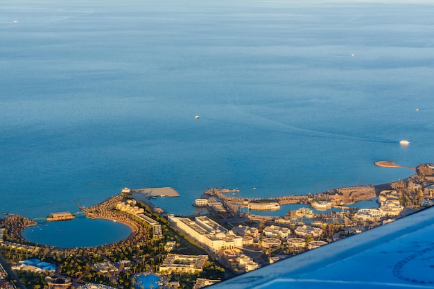 Aerial view on hotels near Hurghada city from the airplane