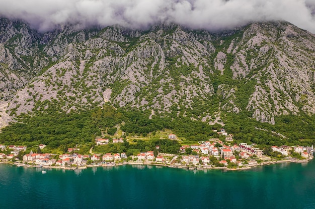 Aerial view of huge mountains and small towns of Kotor Bay, Montenegro