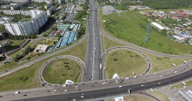 An aerial view of a huge road junction and an industrial urbanscape around it