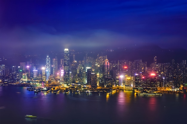 Aerial view of illuminated Hong Kong skyline. Hong Kong, China