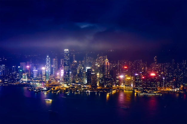 Aerial view of illuminated Hong Kong skyline. Hong Kong, China