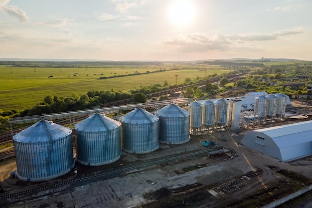 Aerial view of industrial ventilated silos for long term storage of grain and oilseed Metal elevator for wheat drying in agricultural zone