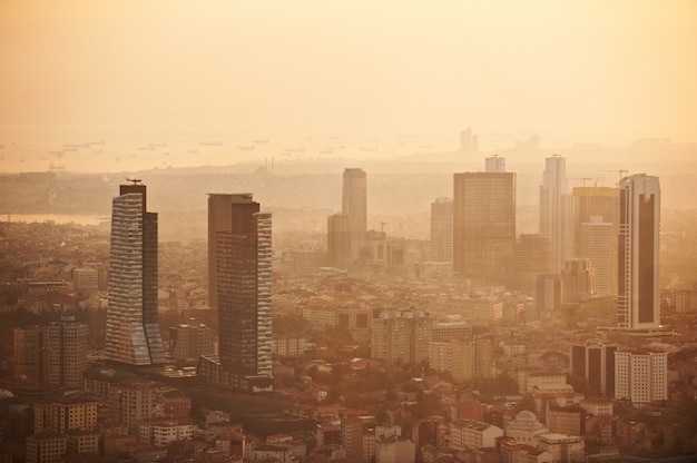 Aerial view of the Istanbul city downtown with skyscrapers at sunset