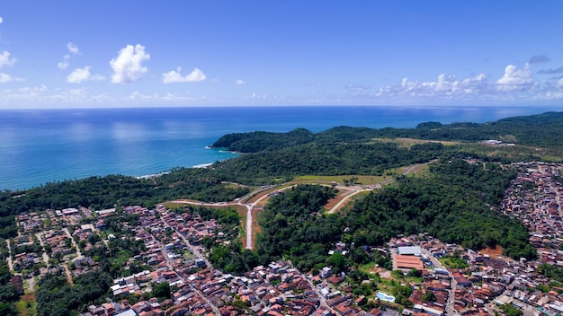 Aerial view of Itacare beach Bahia Brazil Village with fishing boats and vegetation