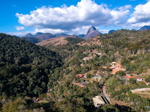 Aerial view of Itaipava, PetrÃÂ³polis. Mountains with blue sky and some clouds around PetrÃÂ³polis, mountainous region of Rio de Janeiro, Brazil. Drone photo. Sunny day.