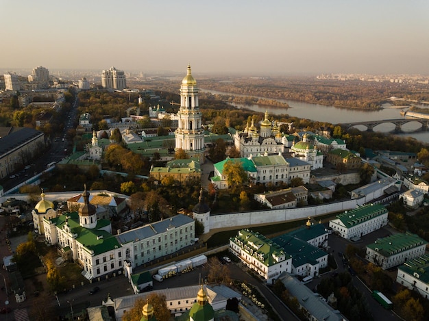 Aerial view to Kyiv Pechersk Lavra at sunset. A UNESCO world heritage site in Ukraine. Center of Kyiv city with view to Dnipro river