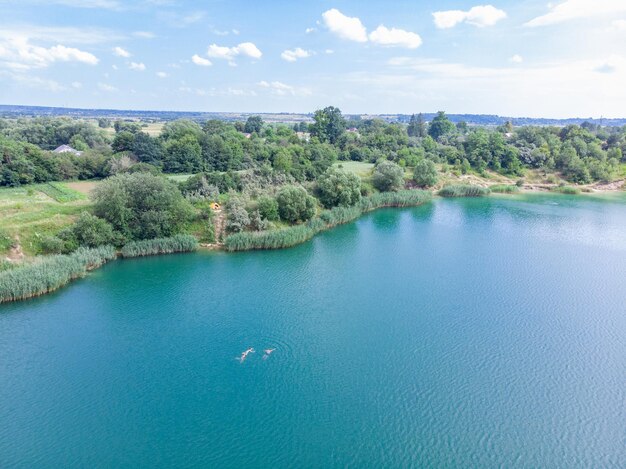 Aerial view of lake with blue water and sand beaches