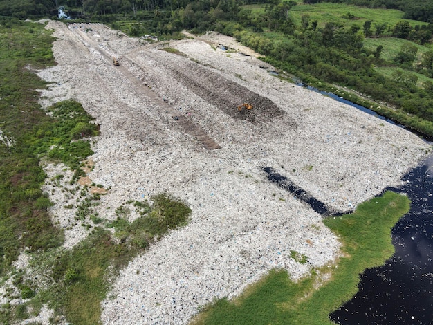 Aerial view landfill garbage waste huge dump environmental pollution problem, Top view on plastic and other industrial waste ecological disaster from above garbage global warming and area waste water