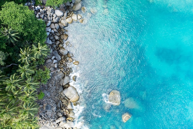 Aerial view landscape nature view of sea crashing waves on seashore Rocky coast at Phuket Thailand