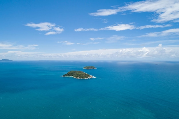 Aerial view landscape of small island in tropical sea against blue sky background Amazing small island beautiful ocean at Phuket Thailand