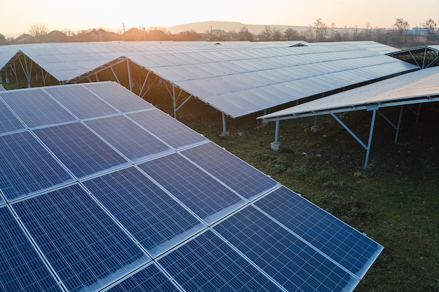 Aerial view of large sustainable electrical power plant with rows of solar photovoltaic panels for producing clean ecological electric energy Renewable electricity with zero emission concept