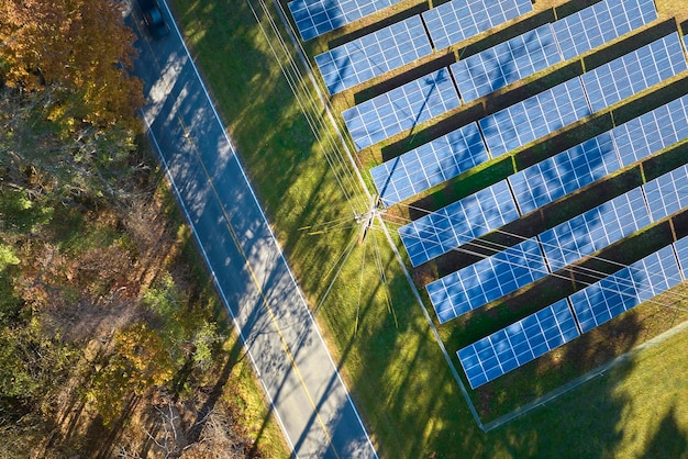 Aerial view of large sustainable electrical power plant with rows of solar photovoltaic panels for producing clean electric energy Concept of renewable electricity with zero emission