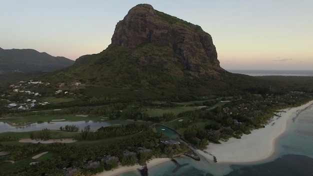 Aerial view of Le Morne Brabant peninsula with mountain, lagoon and white sand beaches. Mauritius Island